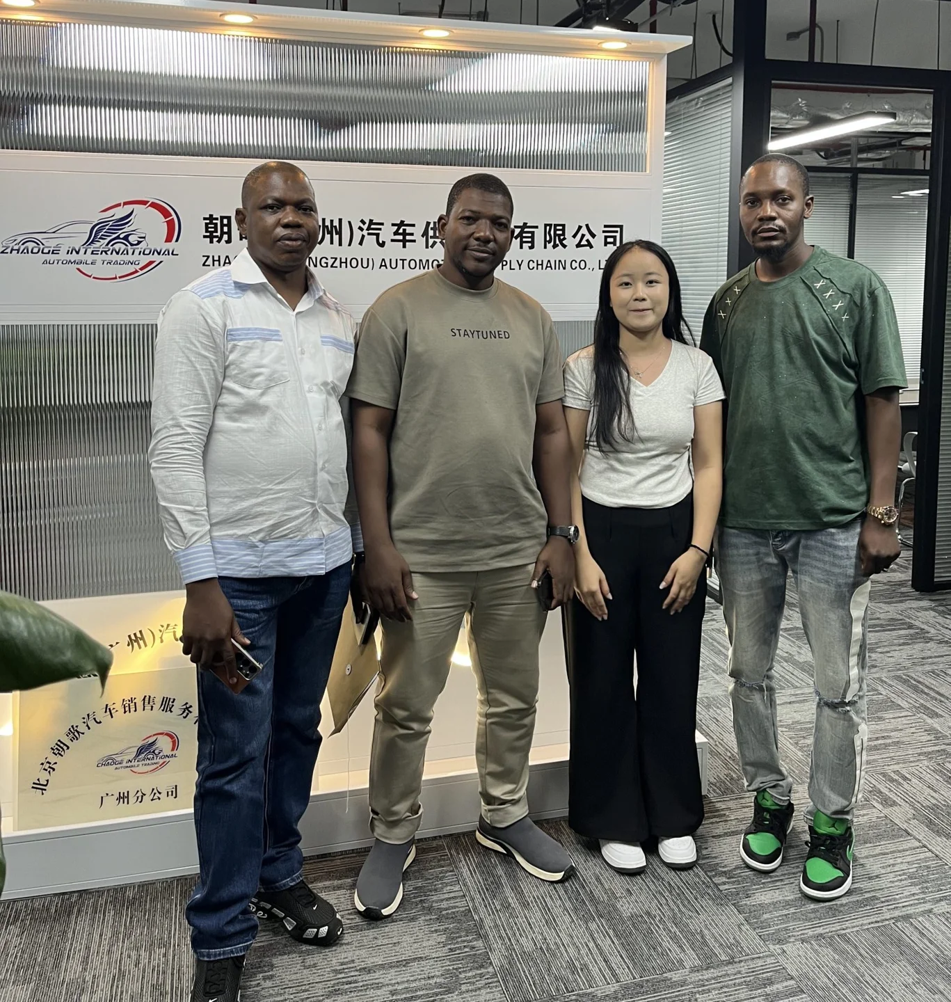 A group photograph in the company showroom